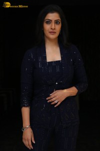 Indian Actress Varalaxmi Sarathkumar in a black dress