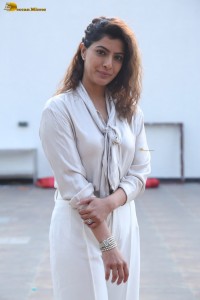 actress Varalaxmi Sarathkumar stylish looks in a white dress