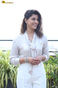 actress Varalaxmi Sarathkumar stylish looks in a white dress
