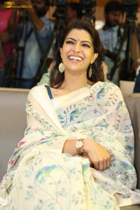 actress Varalaxmi Sarathkumar gorgeous in a white saree with blue pattern