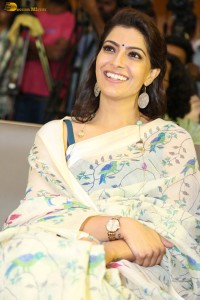 actress Varalaxmi Sarathkumar gorgeous in a white saree with blue pattern