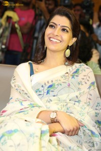 actress Varalaxmi Sarathkumar gorgeous in a white saree with blue pattern