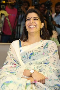 actress Varalaxmi Sarathkumar gorgeous in a white saree with blue pattern