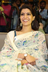 actress Varalaxmi Sarathkumar gorgeous in a white saree with blue pattern