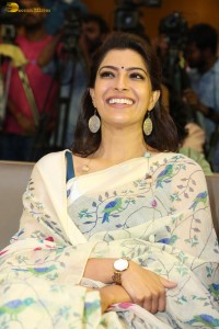 actress Varalaxmi Sarathkumar gorgeous in a white saree with blue pattern