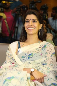 actress Varalaxmi Sarathkumar gorgeous in a white saree with blue pattern
