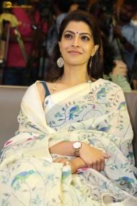 actress Varalaxmi Sarathkumar gorgeous in a white saree with blue pattern