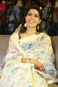 actress Varalaxmi Sarathkumar gorgeous in a white saree with blue pattern