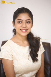 Telugu Actress Varsha Bollamma in a white dress