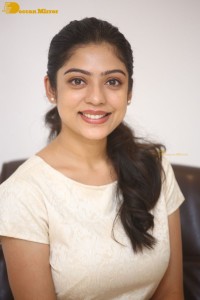 Telugu Actress Varsha Bollamma in a white dress