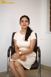 Telugu Actress Varsha Bollamma in a white dress