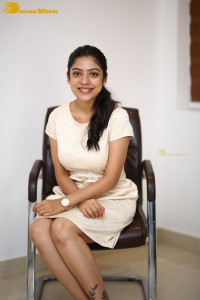 Telugu Actress Varsha Bollamma in a white dress