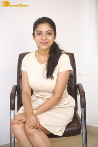 Telugu Actress Varsha Bollamma in a white dress