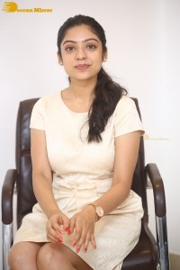 Telugu Actress Varsha Bollamma in a white dress