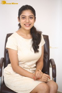 Telugu Actress Varsha Bollamma in a white dress