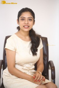 Telugu Actress Varsha Bollamma in a white dress