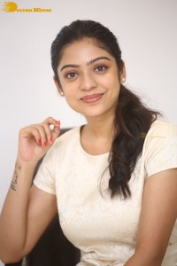 Telugu Actress Varsha Bollamma in a white dress