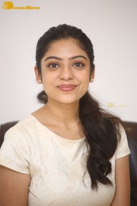 Telugu Actress Varsha Bollamma in a white dress