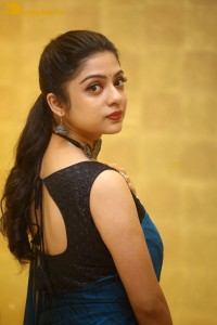 Telugu actress varsha bollamma in a blue saree