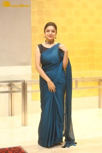 Telugu actress varsha bollamma in a blue saree