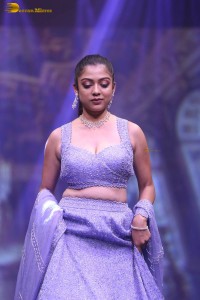 actress varsha bollamma ramp walk in a purple lehenga choli