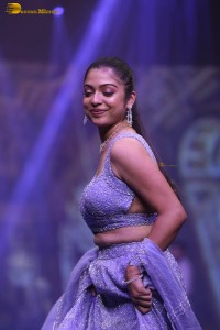 actress varsha bollamma ramp walk in a purple lehenga choli