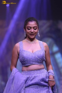 actress varsha bollamma ramp walk in a purple lehenga choli