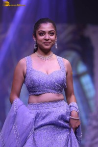 actress varsha bollamma ramp walk in a purple lehenga choli