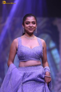 actress varsha bollamma ramp walk in a purple lehenga choli
