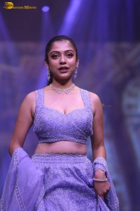 actress varsha bollamma ramp walk in a purple lehenga choli