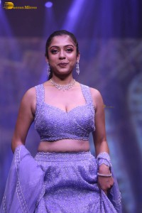 actress varsha bollamma ramp walk in a purple lehenga choli