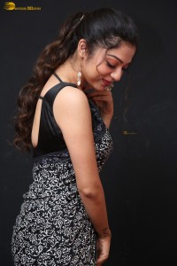 actress Varsha Bollamma cute in a black and white saree