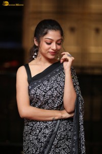 actress Varsha Bollamma cute in a black and white saree