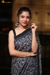 actress Varsha Bollamma cute in a black and white saree