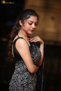 actress Varsha Bollamma cute in a black and white saree