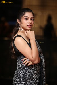 actress Varsha Bollamma cute in a black and white saree