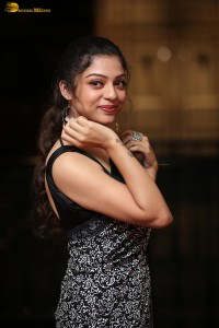 actress Varsha Bollamma cute in a black and white saree