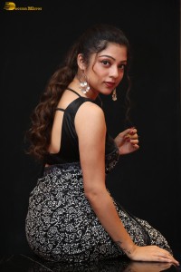 actress Varsha Bollamma cute in a black and white saree