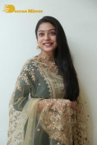 Varsha Bollamma photoshoot in a dark green salwar kameez