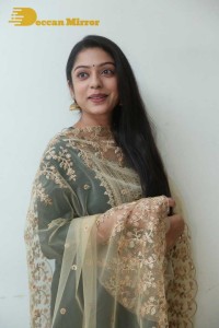 Varsha Bollamma photoshoot in a dark green salwar kameez