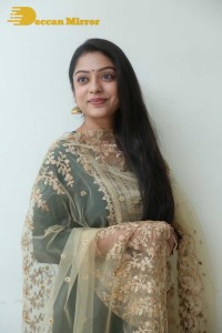 Varsha Bollamma photoshoot in a dark green salwar kameez