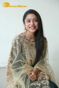 Varsha Bollamma photoshoot in a dark green salwar kameez