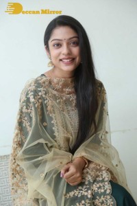 Varsha Bollamma photoshoot in a dark green salwar kameez