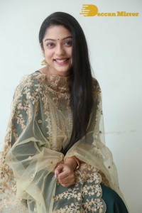Varsha Bollamma photoshoot in a dark green salwar kameez