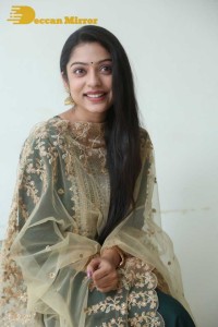 Varsha Bollamma photoshoot in a dark green salwar kameez