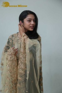 Varsha Bollamma photoshoot in a dark green salwar kameez