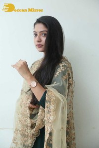 Varsha Bollamma photoshoot in a dark green salwar kameez