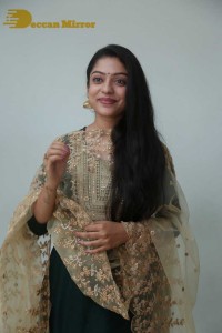 Varsha Bollamma photoshoot in a dark green salwar kameez