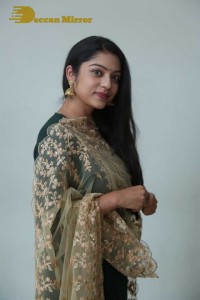 Varsha Bollamma photoshoot in a dark green salwar kameez