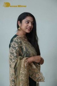 Varsha Bollamma photoshoot in a dark green salwar kameez